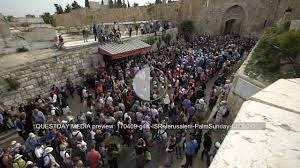 Lions' gate is one of the gates of the old city of jerusalem. Crowd Of Pilgrims At Lion S Gate Of Jerusalem Palm Sunday C0009 01 Bareli S Stock Footage Media Services