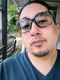 What could cause a cardinal to harass stopped cars at a stoplight?