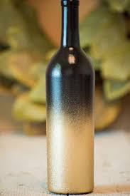 Black Bottle And Yellow Things Wine Bottle Wedding Centerpiece Black And Gold By Katiebluechic Wine Bottle Centerpieces Wedding Wine Bottles Wedding Centerpieces Diy Wine Bottles