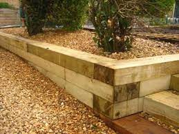 Pin By Jaclyn On Retaining Walls Landscape Timbers Garden Retaining Wall Landscaping Retaining Walls