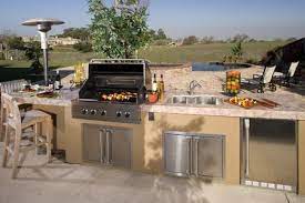 This outdoor kitchen would be best suited for those who only cook out occasionally, but it will still look great all year round to catch your guest's eye. 9 Design Tips For Planning The Perfect Outdoor Kitchen