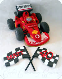 Shield is shown on a 9 round cake. Edible Handcrafted Formula 1 Ferrari Racing Car Cakecentral Com