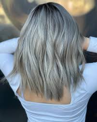 Here, we get a beautiful platinum/ash look, with roots as bright as the rest of her color. 14 Stunning Ways To Get The Dark Ash Blonde Hair Color Trend