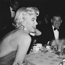 She has built a fanbase of more than 13 million followers on the platform and has garnered over 590 million hearts. Marilyn Monroe Photographed With The King Of Hollywood In The Background Clarkgable 1954 At A Dinner Party Norma Jeane