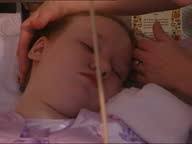 INT Helen Jeffries & another woman lifting Zoe Jeffries into bed CMS...  Stock Footage Video