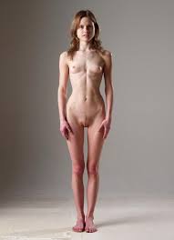 Diminutive Thin Model Standing In The Nude from PetiteGirlNude.com