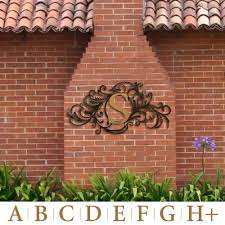 Metal outside decor to put on a brick wall. Evanston Indoor Outdoor Monogram Metal Wall Art Sign