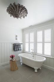 From shiplap to salvaged barn board wood, simple interior wall cladding is making a comeback in home decor, giving rooms a style and texture boost, plus a dose of rugged charm. Wood Paneling For Bathrooms Design Ideas