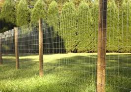 Attach a bracket to a concrete block that is heavy enough to hold the wood or other material you plan to use to build the fence. Fencing Gates