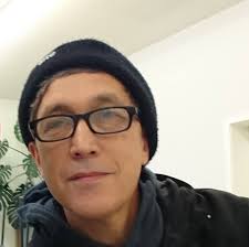 A prison officer marches a working party away from the museum in Umtali. He  is armed with a Greener shotgun, as were the older guys