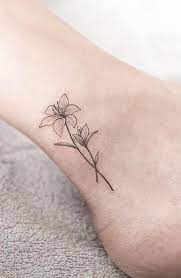 The tattoos are very elegant in their display and they tend to the lily flower can also be applied to show the personal connection to what the person believes. 250 Lily Tattoo Designs With Meanings 2021 Flower Ideas Symbols