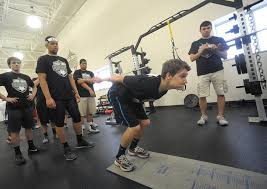 High school football players test skills at pro-style combine