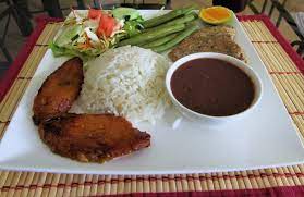 This looks like the mexican tamale, and is made almost the same way, but with different ingredients. 8 Traditional Dishes From The Dominican Republic