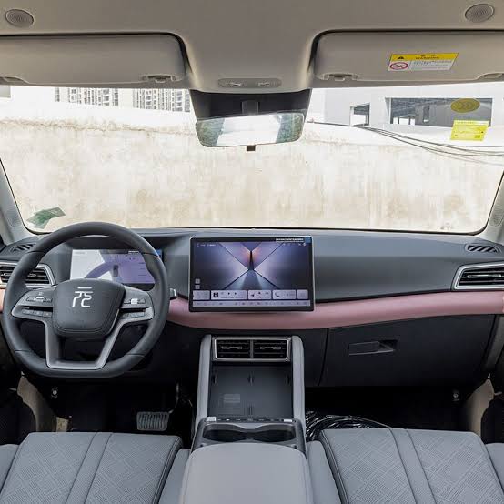 The intelligent cockpit display inside the new 2026 BYD Yuan Up., AI generated
