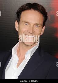 In this June 6, 2013 photo, Stephen Rakes is shown outside the liquor store  he once owned in the South Boston neighborhood of Boston. Authorities  Friday, Aug. 2, 2013 charged William Camuti,