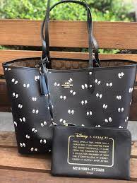 disney x coach reversible city tote in signature canvas and snow white and the seven dwarfs eyes print pet and smoke free h coach tote bags coach disney coach