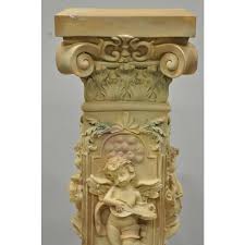 Perfect for an extravagant floral arrangement or statue as the focal po. Greek Style Plaster Corinthian Column Musical Cherub Pedestal Plant Stand Chairish