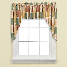 This valance, with its striped pattern in hues of red, green, black, and tan, brings a touch of country cottage charm to kitchens, bathrooms, and beyond. Tranquility Swag Valance In Blue Tan Bed Bath Beyond