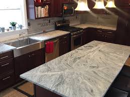 dark cabinets and light granite