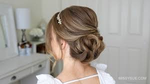 The hair is then finished off with a pretty, floral headpiece. Simple Formal Updo Missy Sue