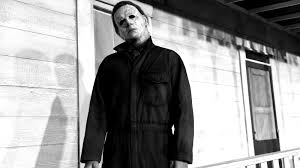 Person Dressed As Michael Myers Creeps Up On Cars In Traffic