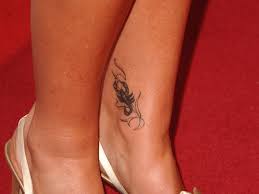 I love the inventive curves of the stinger glyph symbol here. What Tattoo You Should Get According To Your Zodiac Sign