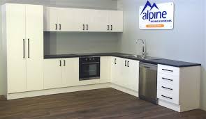 The white cabinets of the main kitchen space goes well with the barnyard kitchen sink and white marble countertops. Black C Handles Kitchen Handles Perth