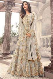 Look gorgeous adorning this yellow color net embroidered anarkali gown crafted with all over detailed thread embroidery and stone work embellishments. Sonal Chauhan Grey Color Gorgeous Party Wear Net Fabric Designer Bollywood Style Floral Embroider Indian Bridal Fashion Pakistani Bridal Dresses Anarkali Dress