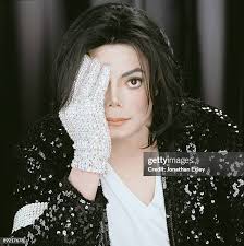 Portrait of singer Michael Jackson , dressed in a shiny silver... News  Photo