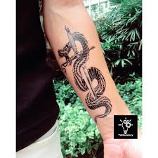 You can easily combine them with other tattoo designs and make it look snake and dagger belly tattoo. Snake And Sword Tattoo Snake And Dagger Tattoo Snake Etsy