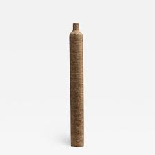 Domingos' designs are the recipient of multiple international sustainability awards. Domingos Totora Furniture Tables Chairs Vases Incollect