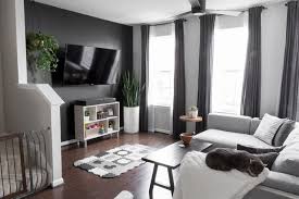 You can turn a weird wall into a focal point. Modern Minimal Townhome For A Family Of Three And Two Cats Townhouse Decorating Simple Living Room Condo Living Room