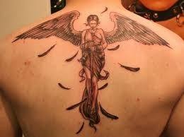 This angel tattoo uses black as it's primary color and it creates a really cool. Angel Tattoo Meanings And Designs Body Tattoo Design Picture Tattoos Fairy Tattoo Designs