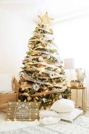 A decorated christmas tree makes for a very jolly home during the holidays. Whimsical Precious Metals Christmas Tree
