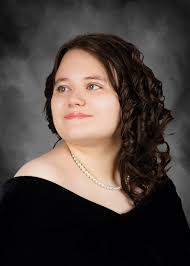 Fixing father-in-law's windy hair in graduation photo