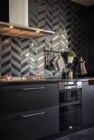 There is an open shelf that displays potted greenery, bowl, and glass mugs. 25 Edgy And Catchy Black Kitchen Backsplashes Digsdigs
