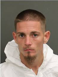 Man arrested after woman found shot and killed at motel near OIA