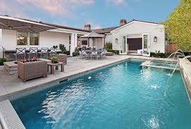 Small Backyard With Pool The Outdoor Is Complete With A Salt Water Pool Spa Built In Bar Gas Barbeque Backyard Pool Small Backyard Pools Backyard Makeover