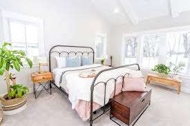 Also, note the reused mason jars and bottles used as vases on the side table. The Defining A Style Series What Is Modern Farmhouse Design