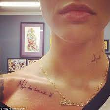 Ruby Rose Inks Makeup Label S Slogan Across Her Chest Rose Neck Tattoo Ruby Rose Tattoo Neck Tattoo