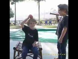Kid Hits Apple Off Another Kid S Head With A Bat Youtube