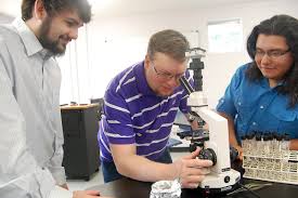 SMC students, professor working