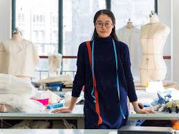 Fashion fun with a heaping helping of farhi's a jolly good lifestyle designer. Chinese Fashion Designer In Fashion Design Studio Portrait By Unite Images Stocksy United