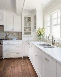 Stainless steel cabinets, granite countertops, black backsplash, glass tile backsplash, stainless steel appliances and an island. 12 Of The Hottest Kitchen Trends Awful Or Wonderful Laurel Home