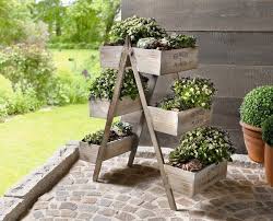 Ladders are versatile structures that can be tweaked into pretty much anything. Diy Flower Stand Turn An Old Wooden Ladder Into A Flower Decoration