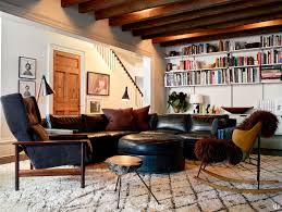 Blankets and throws add another layer of comfort to your sofa, helping your living room look stylish but lived in. How To Decorate A Bookshelf 25 Stylish Design Tips For Your Bookcases Architectural Digest