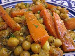 Sweet And Savory Vegetarian Tagine With Carrots And Chickpeas Recipe Tagine Recipes Moroccan Tagine Recipes Moroccan Food