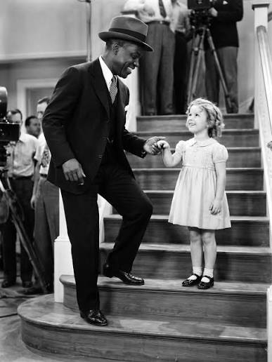 In 1935, Bill “Bojangles” Robinson and Shirley Temple made a groundbreaking  moment in film history with their iconic staircase tap dance in The Little  Colonel. Their performance marked the first time an