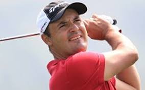 Khan climbs into contention