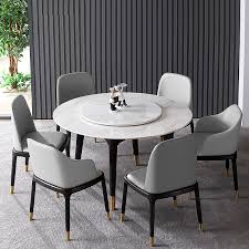 A presentable voguish dining table featuring a round flat base with small metal feet and a round top crafted of black tempered glass. Factory Price Marble Round Dining Table Features Soft Pu Mattress 4 Chairs Or 6 Chairs Solid Wood Frame Design Buy Dinning Table Set Marble Dining Table Round Dinning Table Product On Alibaba Com